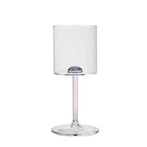 Elegant starry sky wine glass featuring a purple stem and a sparkling blue core detail