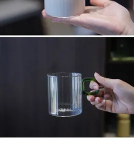Detail view of a ribbed borosilicate glass coffee mug with a green square handle