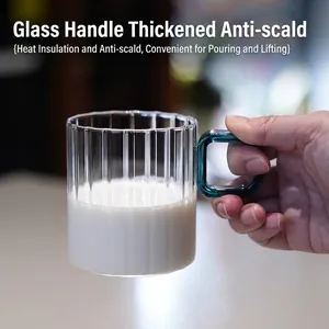 Elegant ribbed transparent glass milk cup with a stylish turquoise handle for latte and coffee