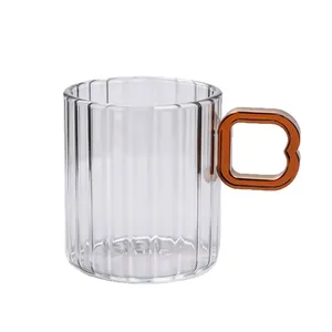 Elegant heat-resistant striated glass coffee cup featuring a unique amber handle
