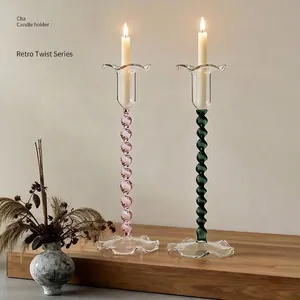 Elegant retro colored spiral glass candle holders with flower bud tops for vintage home decor