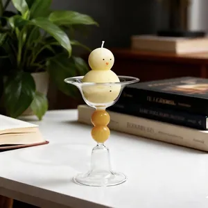 Candeliere europeo minimalista in vetro con stelo a bolle ambrate e candela a forma di pulcino