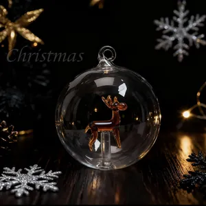 Elegant transparent glass Christmas ball ornament with amber reindeer interior decoration