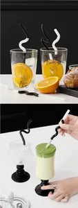 Macro view of artistic curved black and white glass straws in creative reusable design
