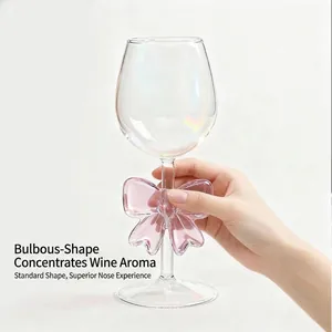 Creative borosilicate glass wine goblet featuring an elegant pink bow knot ornament on stem