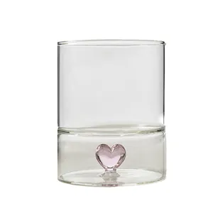 Minimalist creative glass cup featuring a 3D pink heart inside for milk and coffee