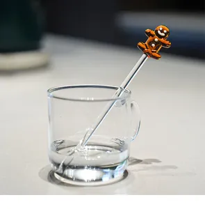 Creative transparent glass cup set with a cute gingerbread man stirring rod detail