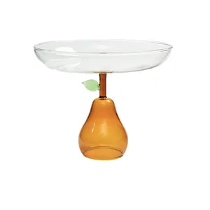 Elegante alzata per frutta in vetro con base ambrata a forma di pera per casa