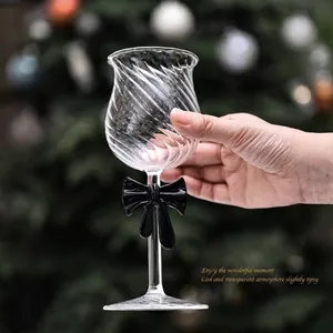 Elegant creative wine glass with black bow tie decoration for romantic occasions