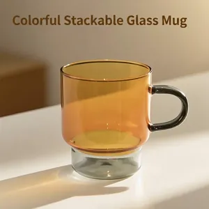 Minimalist stackable amber and grey heat-resistant glass coffee mug with handle
