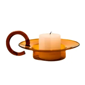 Vintage amber glass candle holder with elegant round handle and circular tray base