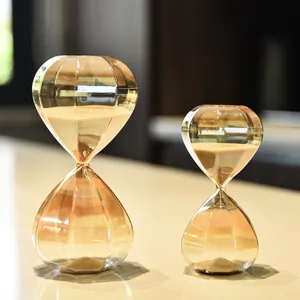 Pair of elegant Nordic diamond-shaped glass hourglasses in orange gradient finish