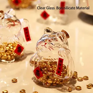 A lucky cat glass jar filled with golden beans for prosperity and wealth savings