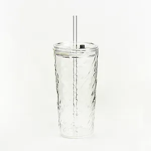Minimalist rippled glass tumbler with clear lid and straw for iced coffee or milk tea drink.
