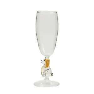 Elegant champagne flute with a cute dog shaped glass stem and transparent bowl