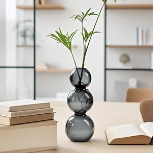 Vase en verre à bulles gris élégant pour culture hydroponique et décor de maison.