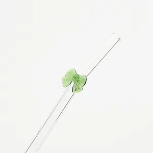Elegante pajita de vidrio reutilizable con un delicado lazo decorativo de cristal verde