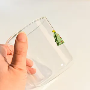 Elegant heat-resistant glass cup featuring a 3D embossed Christmas tree ornament
