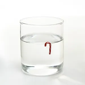 Minimalist transparent Christmas glass cup with a red candy cane relief patch decoration