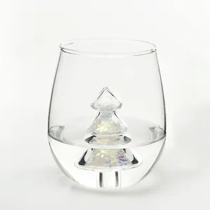 Creative 3D Christmas tree glass cup with colorful iridescent snowflake sequins inside.