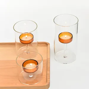 Set of 3 European amber glass candle holders with clear hurricane cylinders and wood tray