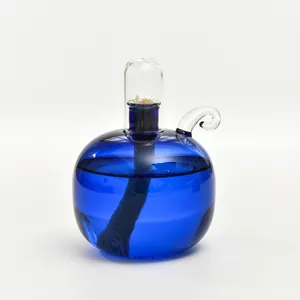 Lampada ad olio moderna e minimalista in vetro blu sferico con coperchio trasparente