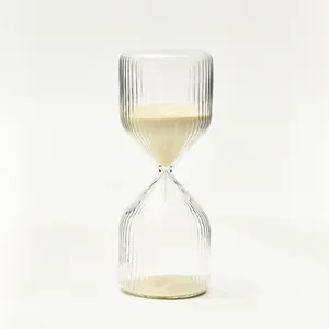 Elegant minimalist ribbed glass hourglass timer with beige sand for modern home decor