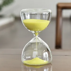 Elegant glass sand timer with bright yellow sand for stylish 5-minute desktop timing