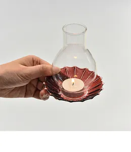 Detailed macro view of vintage windproof glass candle holder with a lit tea light candle