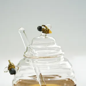 Creative beehive-shaped borosilicate glass honey jar with bee ornaments and stirrer