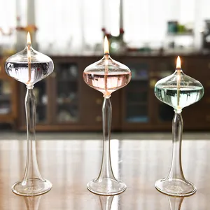 Elegant set of three glass oil lamps with tall stems for romantic home table decoration