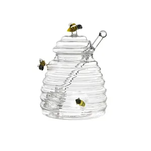 Clear borosilicate glass honey jar with beehive ridges and decorative bumblebee figures