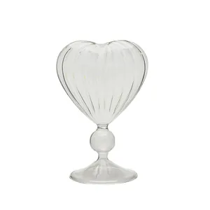 Elegant heart-shaped ribbed glass cocktail goblet with unique stem for home bars