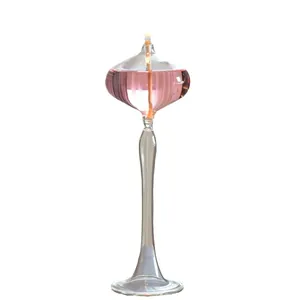 Elegant tall glass oil lamp candlestick holder with pink liquid for romantic home decor