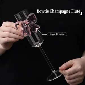 Elegant champagne flute made of borosilicate glass with a romantic pink bow design