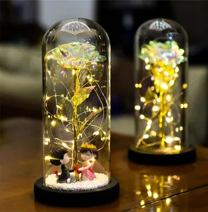 Galaxy rose in glass dome with LED fairy lights and romantic couple figurine decor