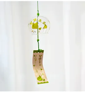 Close-up of a Japanese Edo-style glass wind chime with cute green pear patterns.