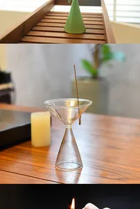 Macro view of a clear hourglass glass incense holder for zen home aromatherapy use.