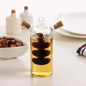 Creative 2-in-1 glass oil and vinegar dispenser with cork stoppers for elegant kitchen.