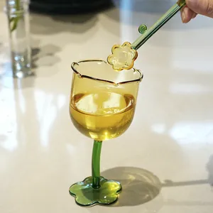 Elegant tulip flower glass goblet with creative crooked green stem and stirrer