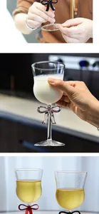 Detailed view of an elegant champagne glass with a decorative purple bow on the stem