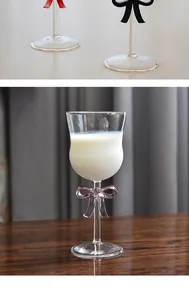 Elegant crystal-clear wine goblet featuring a delicate pink bow tie detail on the stem.