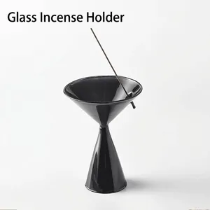 Elegant modern black glass incense holder with minimalist hourglass shape for home decor