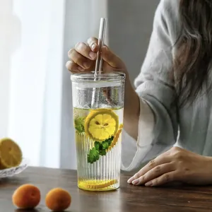 Large aesthetic ribbed glass tumbler with lid and straw for iced coffee and tea