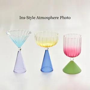 Three colorful gradient glass dessert cups with unique ribbed textures and stems