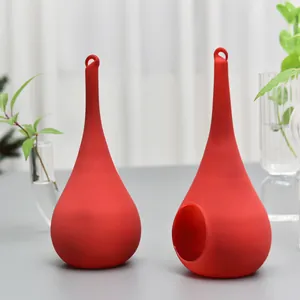 Two elegant red teardrop glass candle holders with hanging loops for home decoration