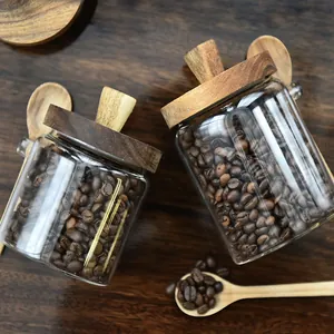 Japanese style airtight glass storage jars with wooden lids and spoons for coffee beans