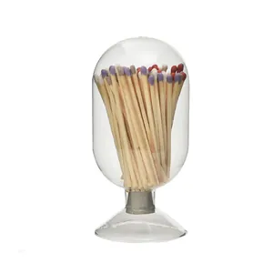 A capsule-shaped glass jar containing eighty long wooden matches for scented candles.