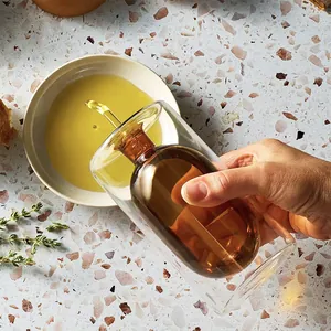 Modern amber double-walled glass oil dispenser bottle for olive oil and vinegar