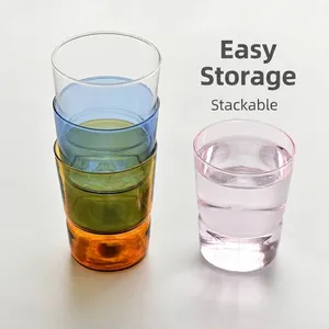 Set of colorful stackable heat-resistant glass cups for water and coffee storage